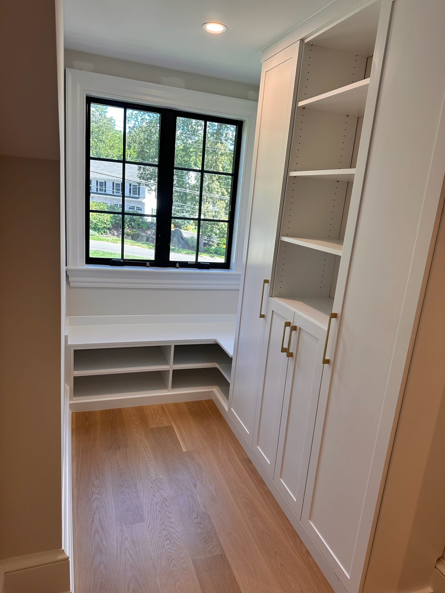 Mud room storage solution with bench and shelving