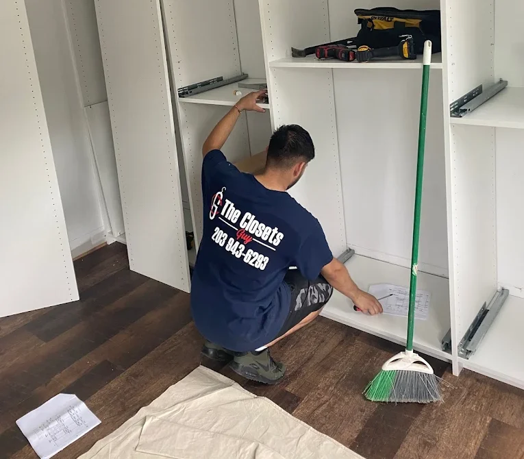 the closets guy team working on closet installation